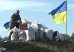 На защиту Харькова - с лопатой. Горожане роют оборонительную полосу на границе области