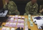 На Харьковщине военком попался на взятке в 1 тыс. долларов